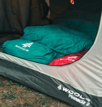 Sleeping bags in a camping tent set up outdoor