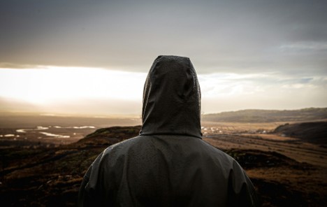 Safari traveller wearing a rain jacket during wet weather in the wilderness